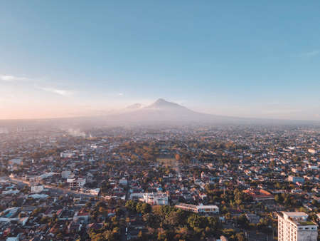 Aerial view of sunset Mount Merapi and Yogyakarta city, Indonesia. City with mountain background view.のeditorial素材