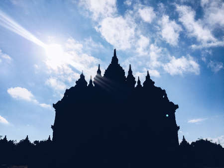 Silhouette view of Plaosan Temple in Plaosan Complex temple with blue sky and sunny sun background. One of the javanese Buddhist temples located in Prambanan, Klaten, Central Java, Indonesia.の写真素材
