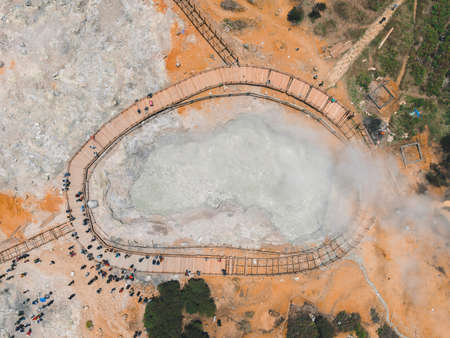 Aerial view of Sikidang crater with the background of sulfur vapor coming out of the sulfur marsh.の写真素材
