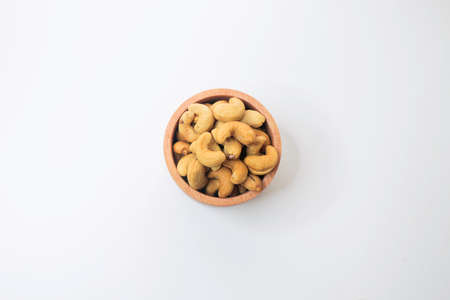 Cashew Nut, in Indonesia known as Kacang Mete. Served in a small bowl on white background.の写真素材