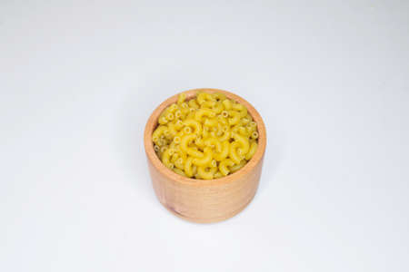 Top view of raw macaroni on white background.の写真素材
