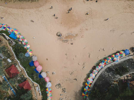 Umbrella in sandy beach at Yogyakarta in Indonesiaの写真素材