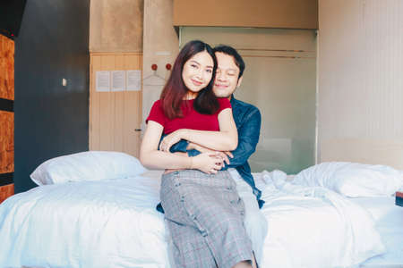 A portrait of a happy couple. Husband and wife hugging each otherの写真素材