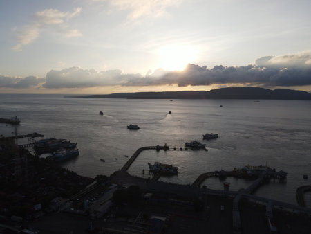 Sunset aerial view of Port in Banyuwangi Indonesia with ferry in Bali Ocean