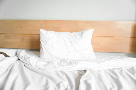 A photo of soft pillows on a comfortable bedの写真素材