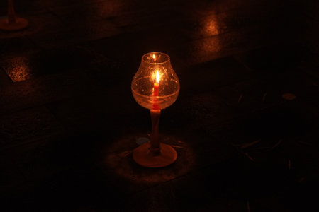 A large number of candles are lit for Vesak Day ceremony in Borobudur Temple, arranged in a row.の写真素材