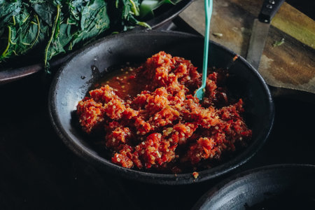 Sambal Bawang or traditional Indonesian spicy onion sauce made with ingredients onion, red chilies, garlic, and salt.の写真素材