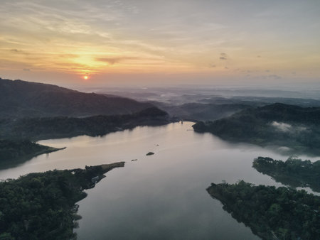 Top aerial view landscape of clear lake named Sermo lake on a bright day in Kulonprogo, Yogyakarta, Indonesia.の写真素材