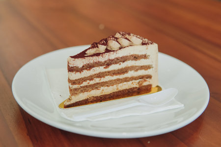 Tiramisu or an Italian layered dessert tiramisu with mascarpone cream and ladyfingers biscuits...