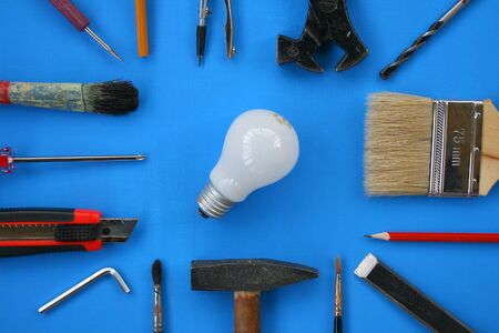 Composition from building tools and an electric bulb.の写真素材