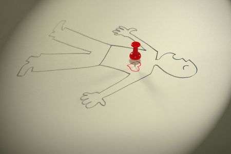 The image of the laying person with the button thrust in heart. の写真素材