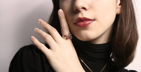 Portrait of the girl with a ring on a hand close up.の写真素材