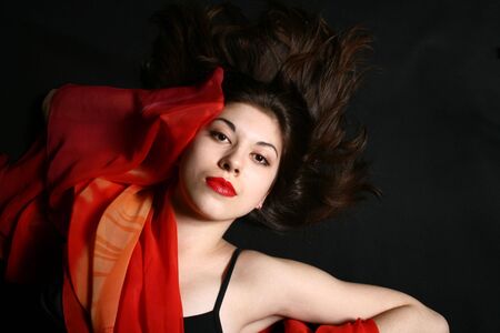 Portrait of the beautiful girl with developing hair.の写真素材