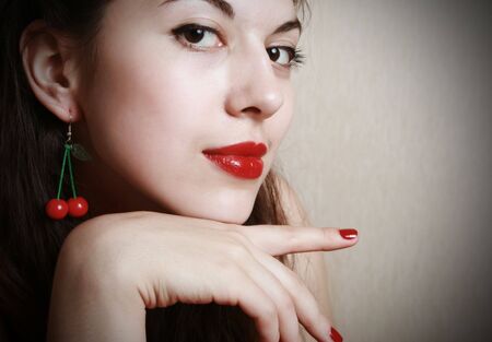 Portrait of the young brunette with red lips.の写真素材