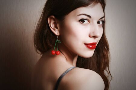 Portrait of the young brunette with red lips.の写真素材