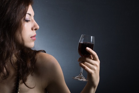 beautiful woman with glass red wineの写真素材