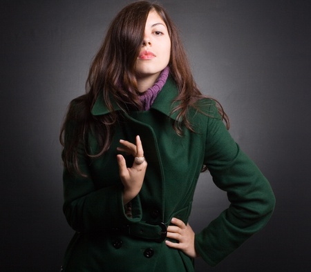 Portrait of a beautiful lady in an elegant coatの写真素材