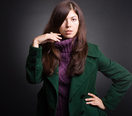 Portrait of a beautiful lady in an elegant coatの写真素材