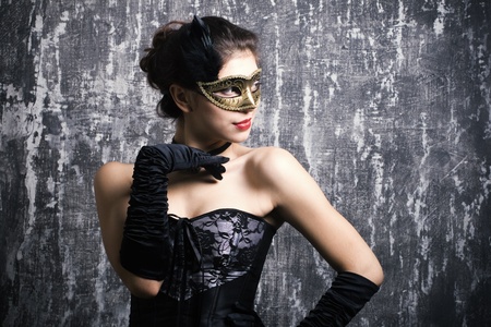 The beautiful young girl in a mysterious maskの写真素材