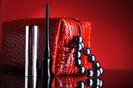 Red bag for makeup and lipstick and mascara.の写真素材