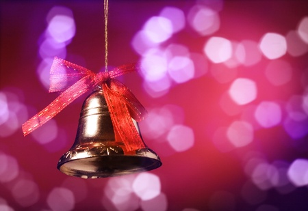 Christmas bell on a red background.の写真素材