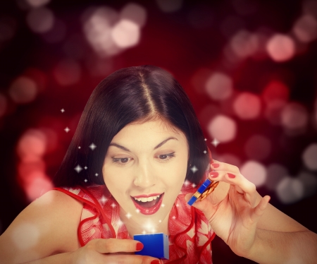 Christmas or New Year Gift. Surprised Womanの写真素材
