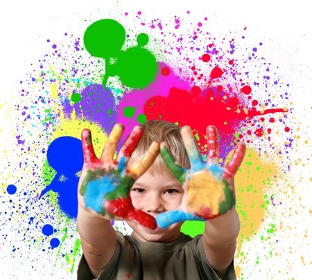 Happy boy with paint smeared hands の写真素材