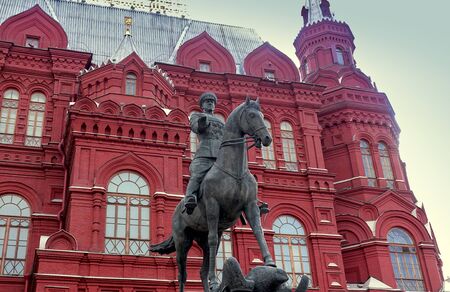 Moscow, Russia. April 14, 2019 Monument to commander Georgy Zhukov against the background of the historical museum.のeditorial素材