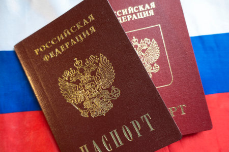 Passports of the Russian Federation on the background of the Russian flag. TEXT TRANSLATION: Russian Federation. The passportの写真素材