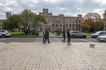 Kiev, Ukraine. October 14, 2022 People walk in the Polytechnic Park near the building of the Kyiv Polytechnic Instituteのeditorial素材