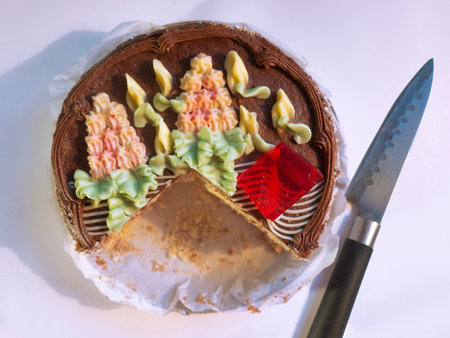 The famous signature Kiev cake and a knife on a white background.の写真素材