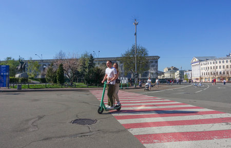 People on Kontraktova Square in Kyiv on a sunny spring dayのeditorial素材