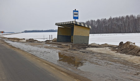 Old bus stop pavilion on a rural roadの写真素材
