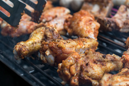 Marinated raw meat just put on the barbecue, chicken and ribsの写真素材