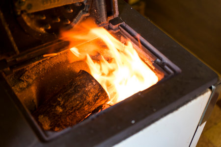 Cookstove opened with wood flames which are burning