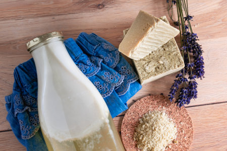 Bottles of homemade laundry on a table, Marseille grated soap, DIY, do it yourself, zero waste, eco friendly, natural product for wash and cleaningの写真素材