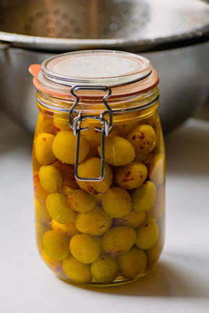 Sterilized mirabelle plums, homemade fruits in syrup for the winter, preserves nutrientsの写真素材