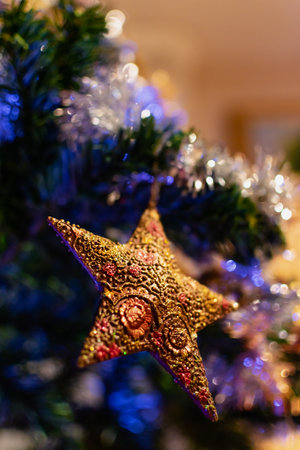 Gold star on christmas tree, decoration and ornament, celebration spirit