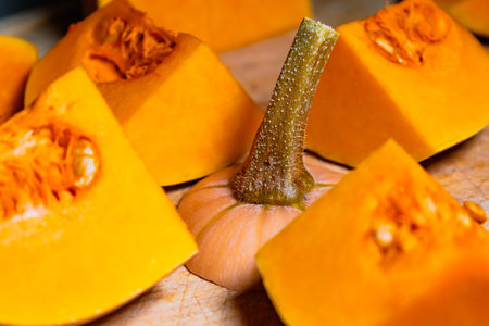 Butternut cut into pieces, squash slices with seeds, cucurbita moschataの写真素材
