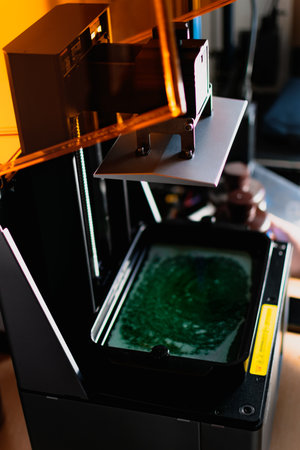3d printer and its resin tank for filling and printingの写真素材