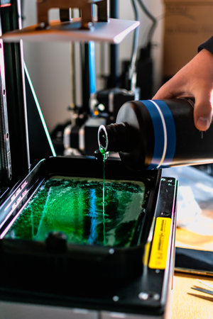 3d printer and its resin tank for filling and printingの写真素材