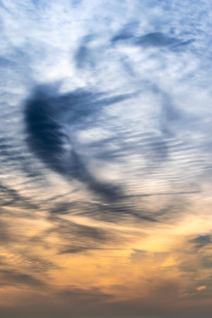 Beautiful striated cloud formation in sky looking like fluffy waves, weather forecast