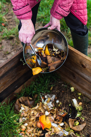 Person who put in a composter some kitchen waste like vegetables, fruits, eggshell, coffee grounds...