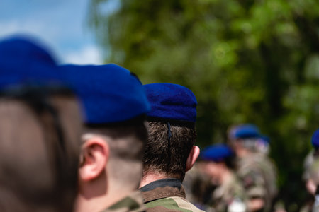 French soldier wearing camouflage uniform, close-up on his back with backgroundの写真素材