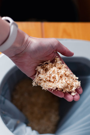 Dry toilet and washable wipe, water saving, compostable, wood chips, eco friendly gesture, sustainable lifestyleの写真素材