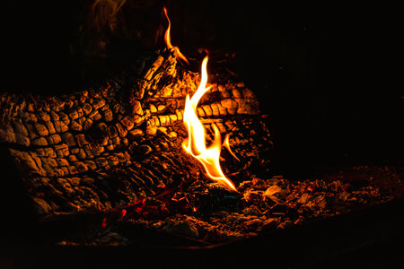 Fire in a fireplace in the living roomの写真素材