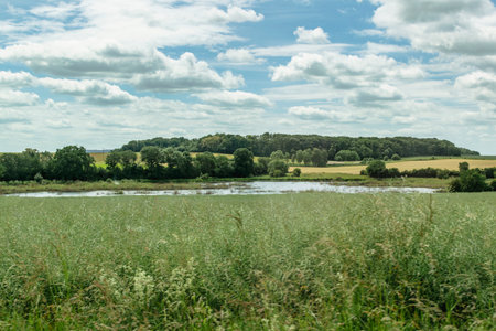 Countryside landscape with sky and fields, real life photoの写真素材