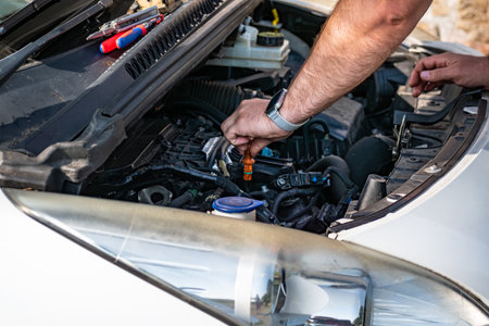 Engine oil check before car journey for safety travel