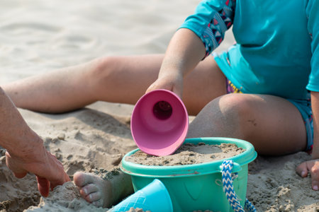 Child playing on a beach, good activity and sport for health and mental healthの写真素材
