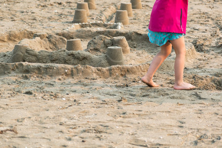 Child playing on a beach, good activity and sport for health and mental healthの写真素材